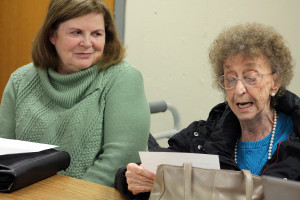 Marcie Leitzke, right, a founding member of the Shawano Area Writers when it formed in 1966, reads one of the columns she writes for the local newspaper, during a regular meeting of the group. Barb King, who is listening to Leitzke’s recitation, has been with the group for several years and is in the process of publishing a book about a one-room schoolhouse and the children who received an education there. (Photo by Lee Pulaski)